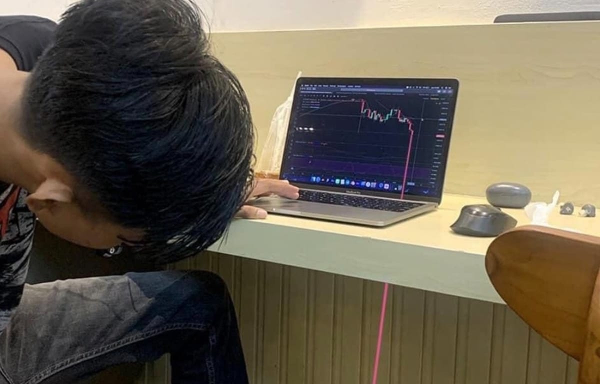 Meme of a trader watching prices fall so far they go down the wall.